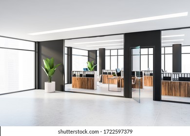 Corner Of Modern Panoramic Office With Black Walls, Tiled Floor, Dark Wooden Cubicles With Computer Tables And File Cabinets. Windows With Blurry Cityscape. 3d Rendering