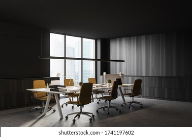 Corner Of Open Space Office With Gray And Dark Wooden Walls, Concrete Floor, Long White Table With Laptops And Leather Chairs And Window With Blurry Cityscape. 3d Rendering