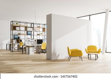 Corner Of Open Space Office With White Walls, Wooden Floor, White Computer Tables With Yellow Chairs, Wooden Bookcase With Folders And Lounge Area With Yellow Armchairs. 3d Rendering