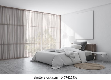 Corner of stylish bedroom with white walls, concrete floor with carpet, comfortable bed with white blanket and vertical mock up poster. Window with blinds. 3d rendering