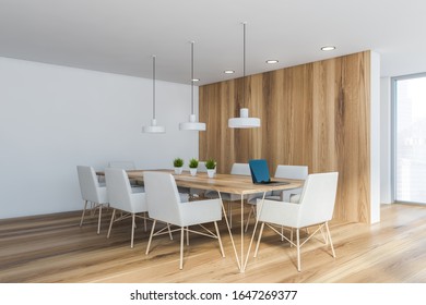 Corner Of Stylish Office Conference Room With White And Wooden Walls, Long Meeting Table With White Armchairs And Industrial Style Lamps Hanging Above It. 3d Rendering