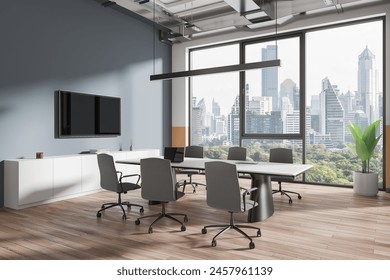 Corner of stylish office meeting room with gray walls, wooden floor, panoramic window with cityscape and long conference table with gray chairs. TV set on the wall. 3d rendering - Powered by Shutterstock