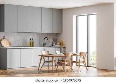 Corner view of bright cozy kitchen room interior with cupboard, dinner table, panoramic window, olive oil, sink. Modern Scandinavian minimalist design. 3d rendering