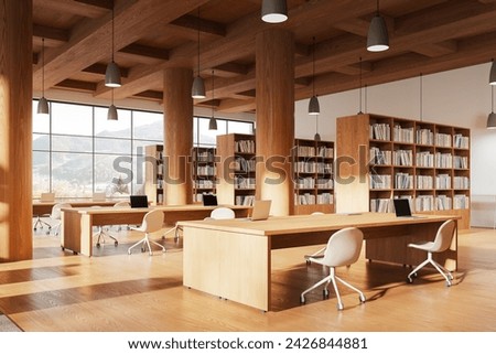 Corner view of library interior with table and chairs, hardwood floor. Learning or coworking space with large wooden bookshelf and books. Panoramic window on countryside. 3D rendering