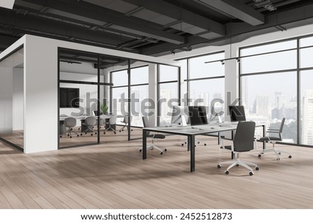 Corner view of office interior with pc computers and chairs in row, hardwood floor. Business workplace with glass meeting room and tv screen, panoramic window on Singapore skyscrapers. 3D rendering
