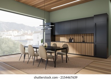Corner view on bright kitchen room interior with dining table with chairs, panoramic window, cupboard, green wall, sink, plates, lamps, oil, wooden floor. Concept of minimalist design. 3d rendering