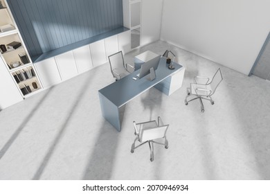 Corner Of White And Blue Office Interior With Desktop, Stylish Niche, Cabinets, Three Rolling Chairs And Concrete Floor. Concept Of Modern CEO Work Place Design. No People. 3d Rendering