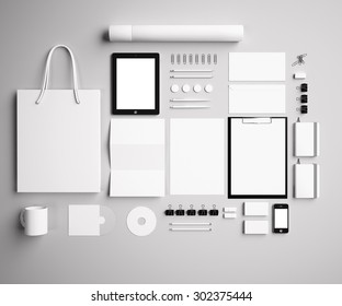 Corporate Identity Mock Up On A Gray Background. Set Includes Package, A Tube, A Pencil, A Tablet, A Smartphone; Icon; Clip, Business Cards, Pens, CD, Flash Card, Paper Clips, Erasers, Cup, Sticker