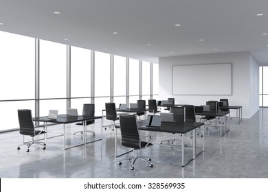 Corporate Workplaces Equipped By Modern Laptops In A Modern Panoramic Office, White Copy Space In The Windows. Black Leather Chairs And A Black Tables, A Huge Whiteboard On The Wall. 3D Rendering.