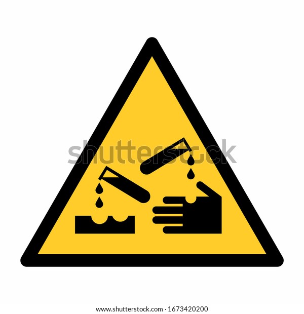The\
Corrosive hazard sign isolated on white\
background