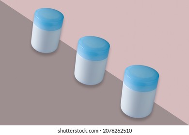 Cosmetic Jars With Blue Cap Mockup Isolated On Bicolor Background