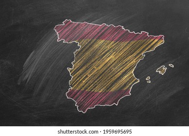 Country Map And Flag Of Spain Drawing With Chalk On A Blackboard. One Of A Large Series Of Maps And Flags Of Different Countries. Education, Travel, Study Abroad Concept.