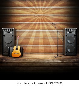 Country music stage or singing background, microphone, guitar and speakers with wood flooring and sunburst background. Advertising concept with room for text or copy space