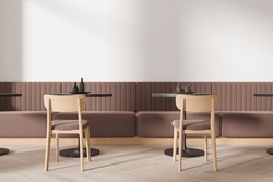 Cozy Restaurant Interior With Chairs And Round Table With Dishes In Row, Brown Sofa On Hardwood Floor. Minimalist Cafe Eating Space With Modern Furniture. 3D Rendering