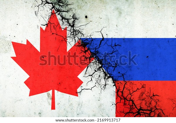 Cracked flags of Russia and Canada.\
International political relations. Conflict. Political Economic\
background.\
Politics.