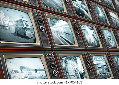 Creative Abstract Television Broadcasting, News Media, Business, Entertainment And Cinema Concept: Wall Of Old Wooden Black And White TV Screens With Various Broadcast Channels