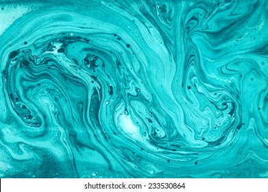 Creative background with abstract acrylic painted waves. Turquoise marble texture. Blue handmade surface.