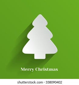Creative White Christmas Tree on Green Background.