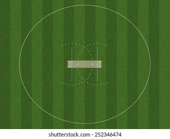 A cricket pitch marked in white on green grass