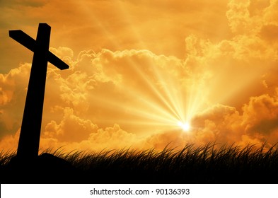 cross silhouette with the sunset as background