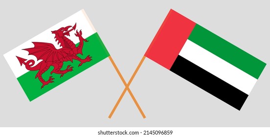 Crossed Flags Of The United Arab Emirates And Wales. Official Colors. Correct Proportion