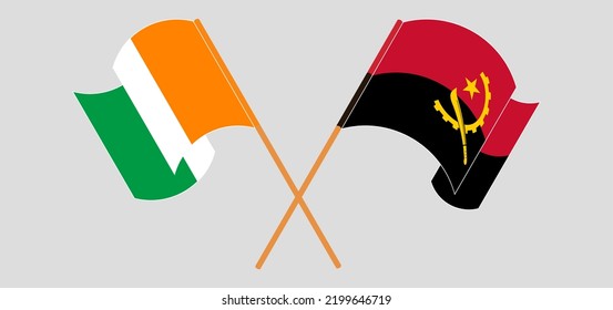 Crossed And Waving Flags Of Angola And Republic Of Ivory Coast