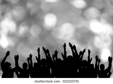 Crowd hands up with bokeh background 