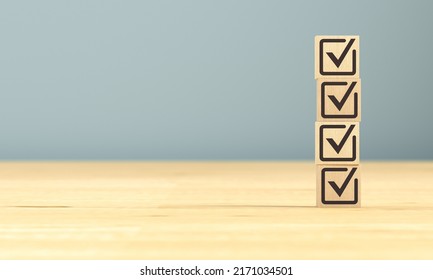 Cubes with a check mark on a wooden surface. 3d rendering. - Shutterstock ID 2171034501