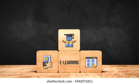 cubes with message E-LEARNING and education symbols on wooden base in front of a blackboard - 3d illustration