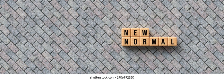 cubes with message NEW NORMAL on concrete background - 3d illustration