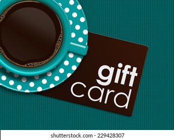 Cup Of Coffee With Gift Card Lying On Tablecloth