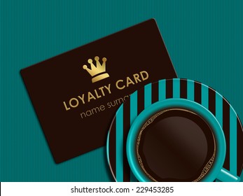 Cup Of Coffee With Loyalty Card Lying On Tablecloth