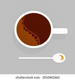 A Cup of Coffee with a spoon on the side. A perfect breakfast companion to start your day.