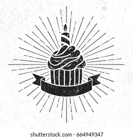 cupcake silhouette with scroll and sunburst on grunge background