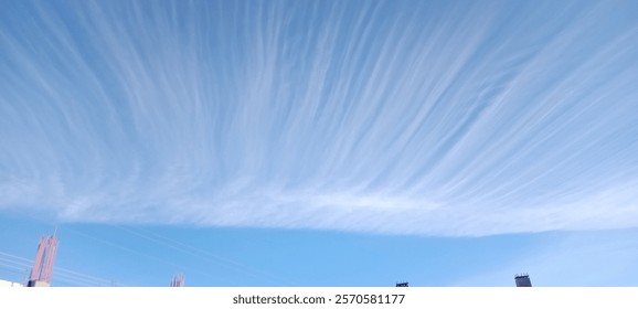 curious clouds in blue sky