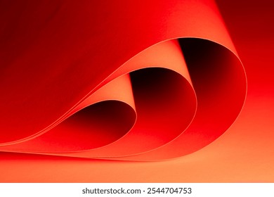 Curved shapes in vibrant red and orange blend together harmoniously, creating an engaging abstract composition that invites the viewer to explore textures and colors. - Powered by Shutterstock