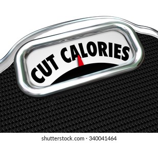 Cut Calories Words On A Scale Display To Illustrate Dieting To Eat Less And Lose Weight