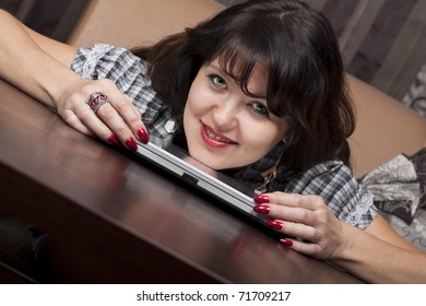 Cute young lady with a computer