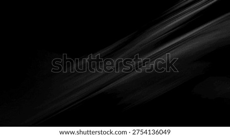 A dark abstract composition featuring diagonal light streaks and soft gradients.