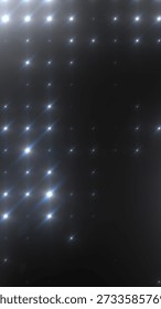 Dark abstract star grid with diagonal sparkling flares and soft glow, cosmic or LED pattern background.