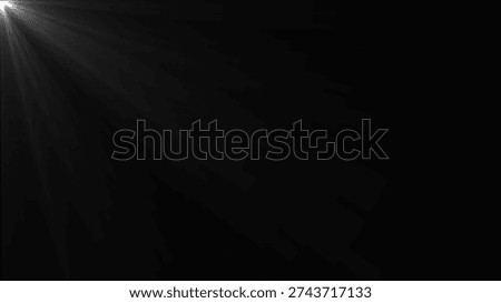 A dark background with soft, diffused light rays emanating from the left side, creating a dramatic and moody atmosphere