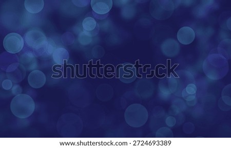 A dark blue background with a multitude of blurry, glowing blue circles scattered throughout