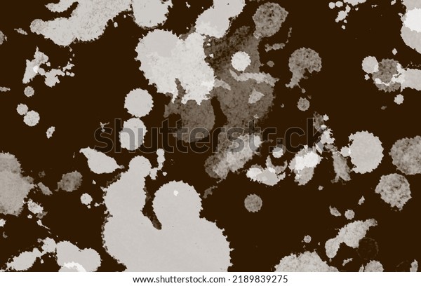 Dark chocolate color background with round white, beige and light brown spots finished in small spikes. It has the tone of chocolate and the spots simulate cream. Can also be used as texture.