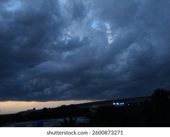 Dark clouds usually indicate rain, storms, or unsettled weather. They appear dark because they are thick and dense, blocking sunlight from passing through.