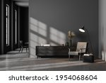 Dark contemporary waiting room interior with wooden sideboard, small coffee table and comfortable black armchair on concrete floor. Minimalist Scandinavian design. Mock up. 3d rendering