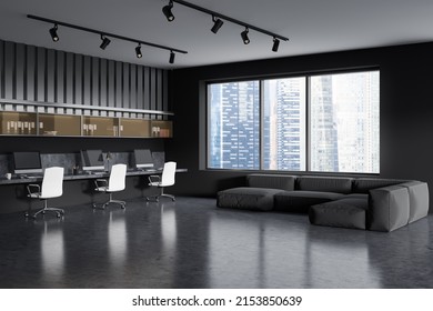 Dark Coworking Room Interior With Chill Area, Sofa And Work Zone With Armchairs And Pc Computer, Side View, Grey Concrete Floor. Panoramic Window On Singapore City View. 3D Rendering