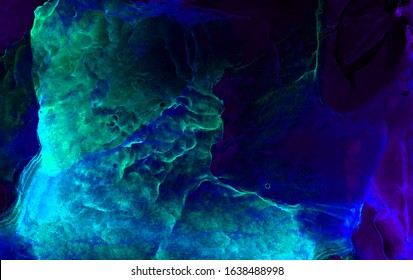 Dark deep indigo blue alcohol ink neon abstract background. Glowing flow liquid watercolor paint splash texture effect illustration for card design, modern banners, ethereal graphic design
