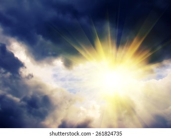 Dark dramatic sky with heavy clouds and bright yellow light.
