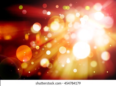 Dark gold glitter sparkles rays lights bokeh festive elegant abstract background.