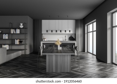 Dark Grey Kitchen Room With Kitchen Set On Black Parquet Floor. Eating Table With Chairs, Bookshelf And Window, 3D Rendering No People